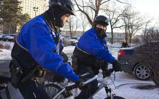 Public Safety officers Jon Seefeldt (left) and Jonathan Young patrol the St. Peters parking lot on February 3rd. Four break-ins were reported in the same lot the day before.  Noah Berman / Photo Editor