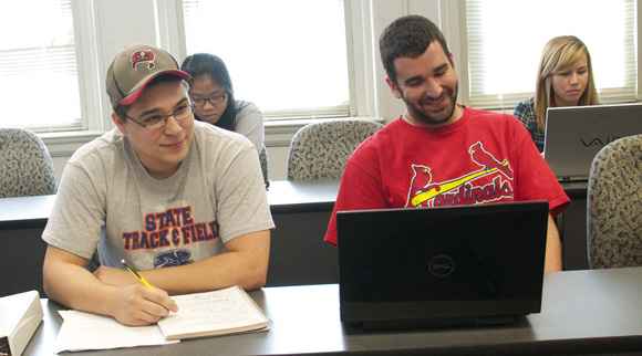 Junior Aaron Alexander (left) and Donnie Green, with the help of their sports business education, hope to one day run the teams they cheer on. Shah (Yuqing Xia) / Photo Editor