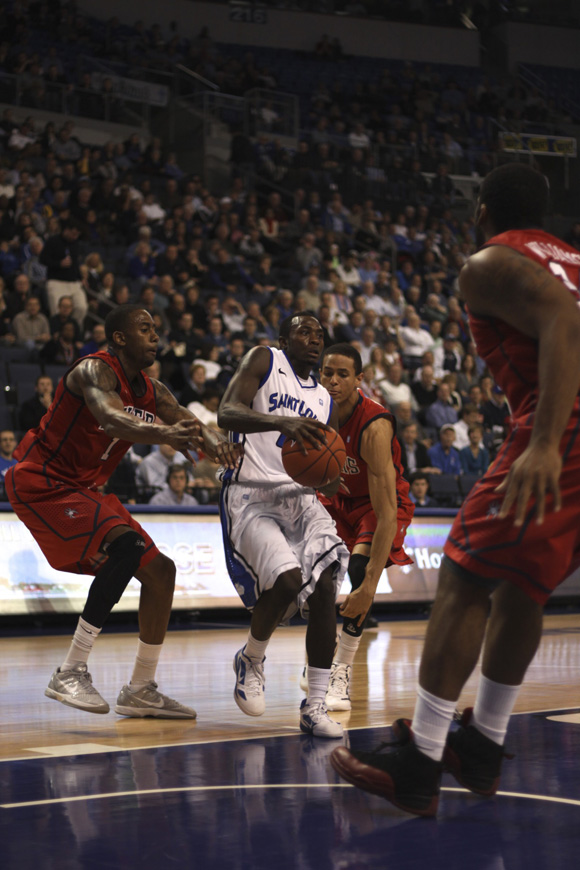 Mike McCall Jr. Splitting through the defense against Richmond 2/15/2012, Ryan Doan/ Staff Photographer