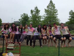 Holi participants from last year, covered in colored powder and water from water balloons. Photo Courtesy of Deval Patel 