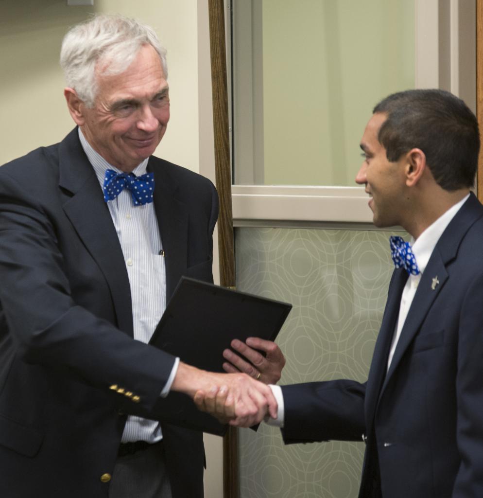 An honorable farewell: Interim President Bill Kauffman receiving his award from SGA on Wednesday. John Schuler / Photo Editor