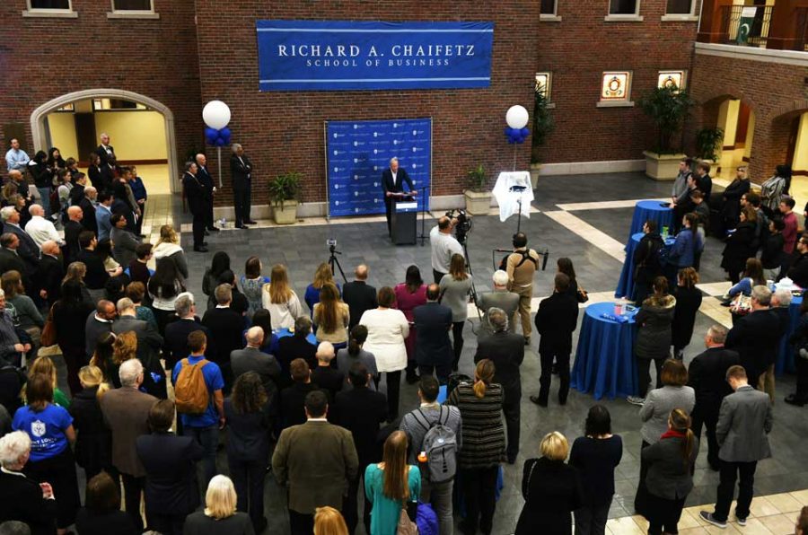 Students%2C+staff+and+faculty+gather+in+the+newly+renamed+Richard+A.+Chaifetz+School+of+Business+to+listen+to+Dr.+Chaifetz+speak+about+his+relationship+with+the+University.