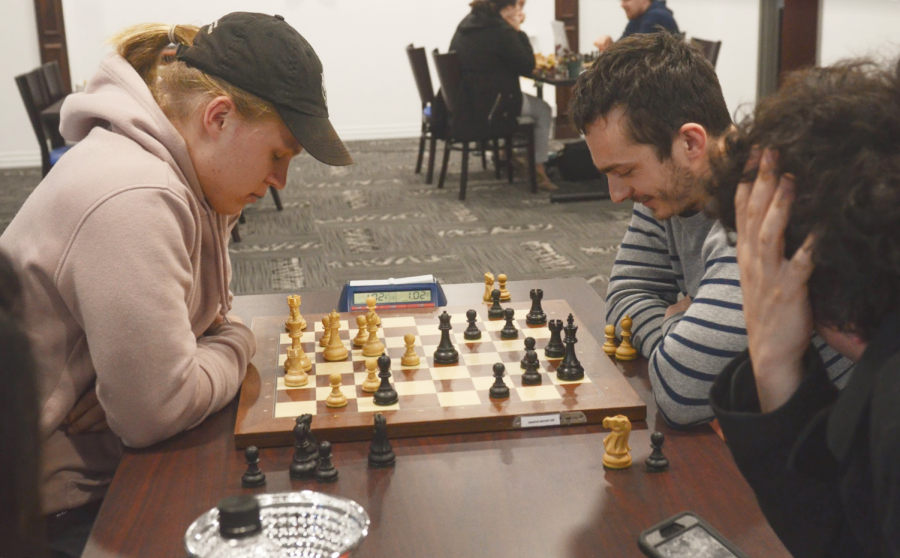 Concentration: SLU Chess coach Alejandro Ramirez looks on in a game of chess during Atlas Week. SLU Chess has placed twice in the Presidents Cup Tournament.