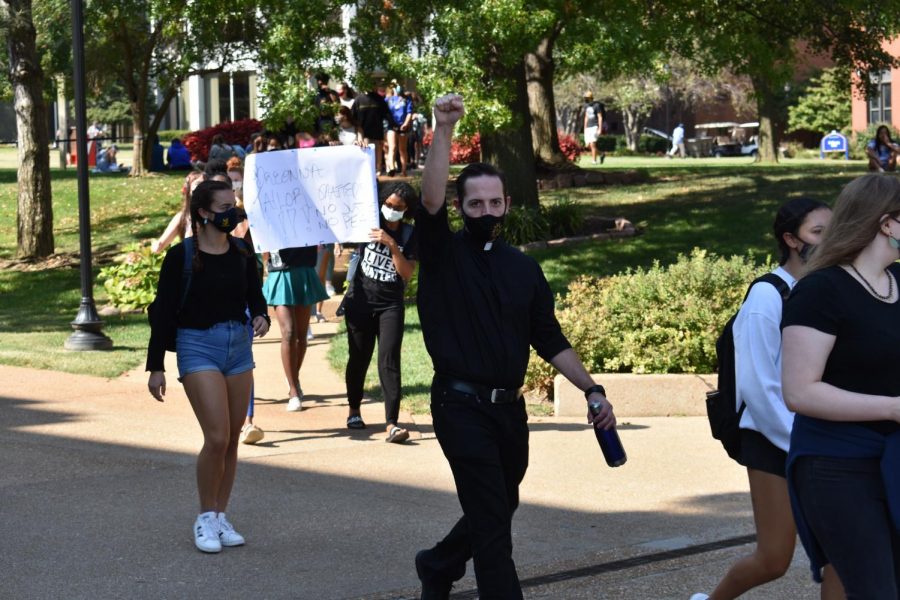 Jesuits Protesting - by Brooke Kenworthy