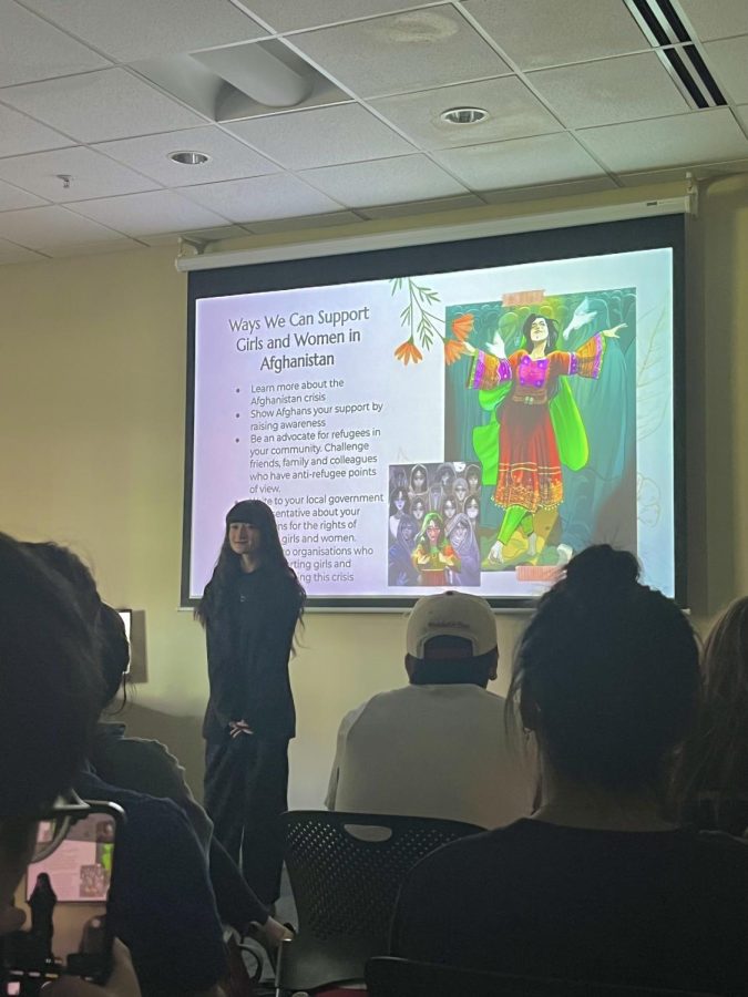 Freshman Sahar Hussaini speaks at an Atlas Week event on April 18 about supporting Afghani women. (Harsirat Kaur/ The University News)