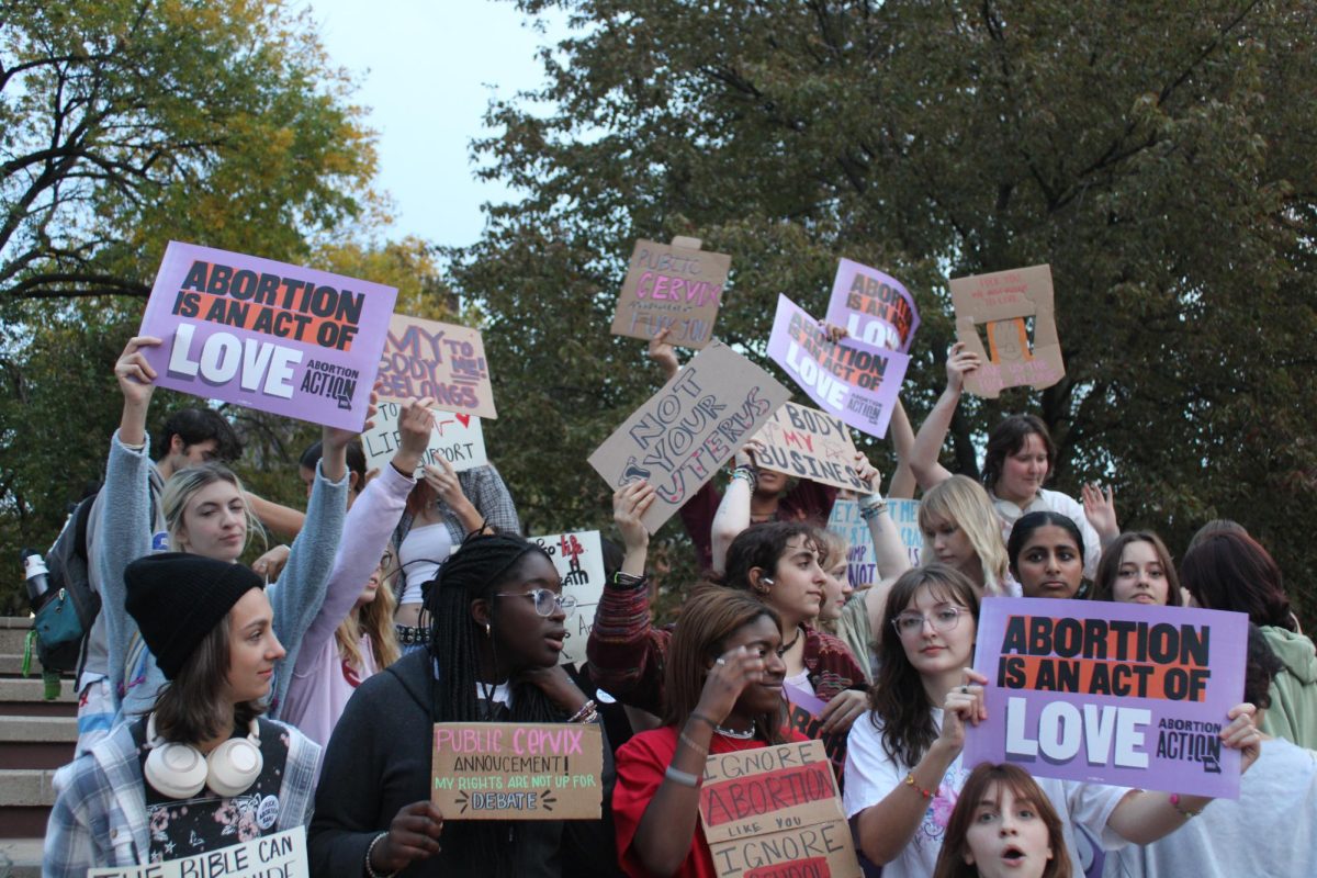A group of students protest at the Clock Tower in support of abortion rights on Oct. 24. (Camille Smith / The University News)