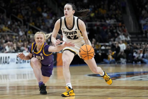 Caitlin Clark blows by LSU guard, Hailey Van Lith, in Elite Eight matchup against the Tigers.