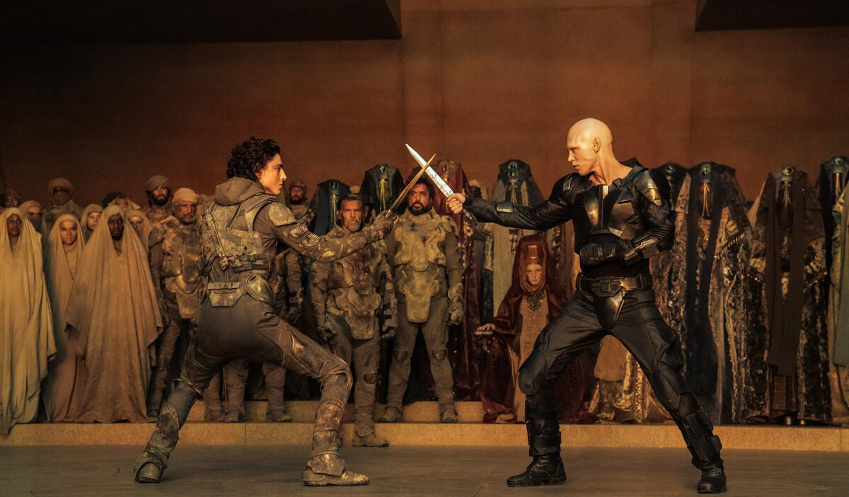 This image released by Warner Bros. Pictures shows Timothee Chalamet, foreground left, and Austin Butler in a scene from “Dune: Part Two.”