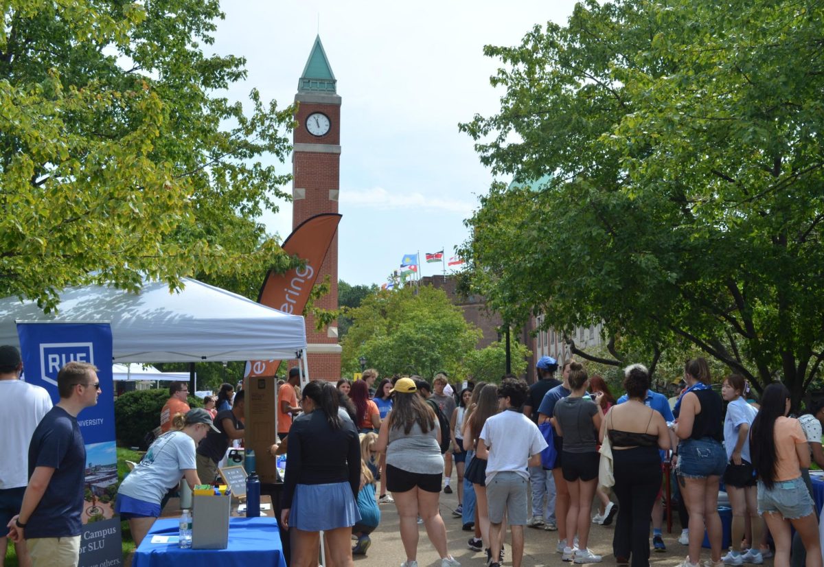 The Clock Tower is the heart of the Involvement Fair as countless students gather by the surrounding tables.