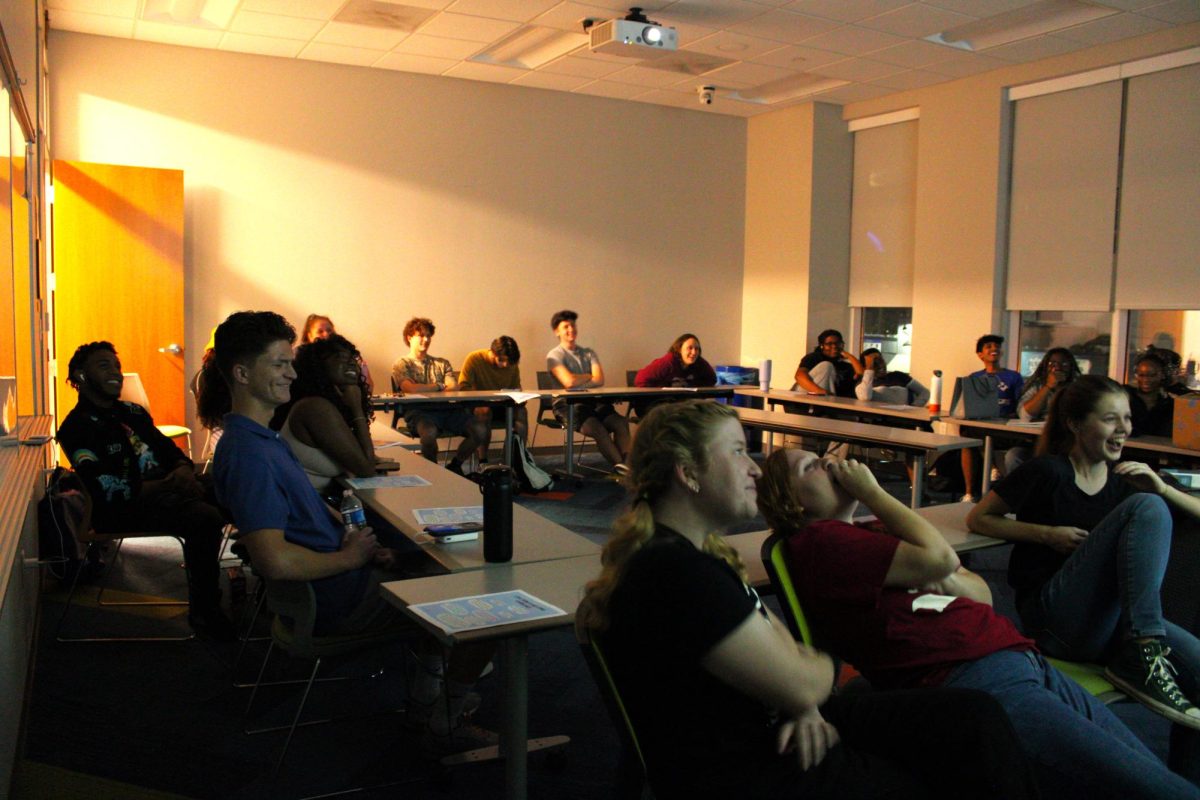 Students react to the presidential debate at a watch party hosted by the Center for Social Action on Tuesday, Sept. 10, 2024. 