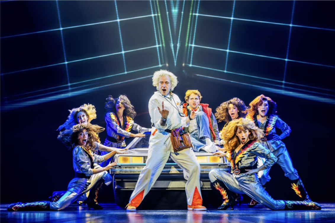 Pictured (L-R): Don Stephenson (Doc Brown), Caden Brauch(Marty McFly), and the Company of Back to the Future: The Musical.