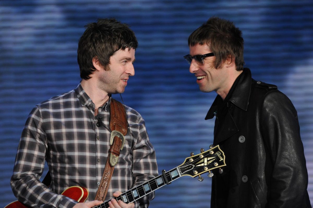 Noel (right) and Liam (left) Gallagher smile at each other after a concert in Milan, Italy in 2008.