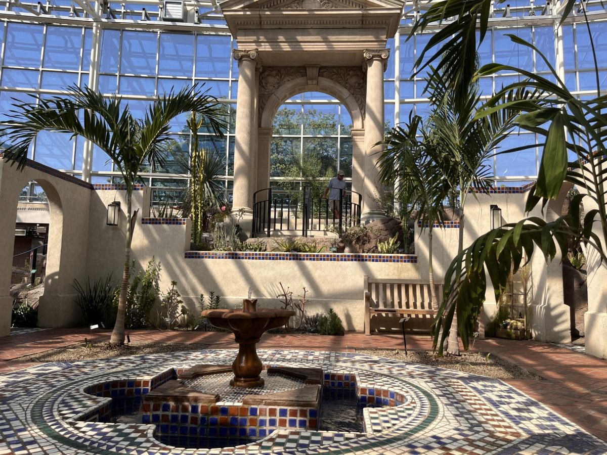 The Shoenberg Arid House’s walled gardens and Manila palms (Adonidia Merrillii).