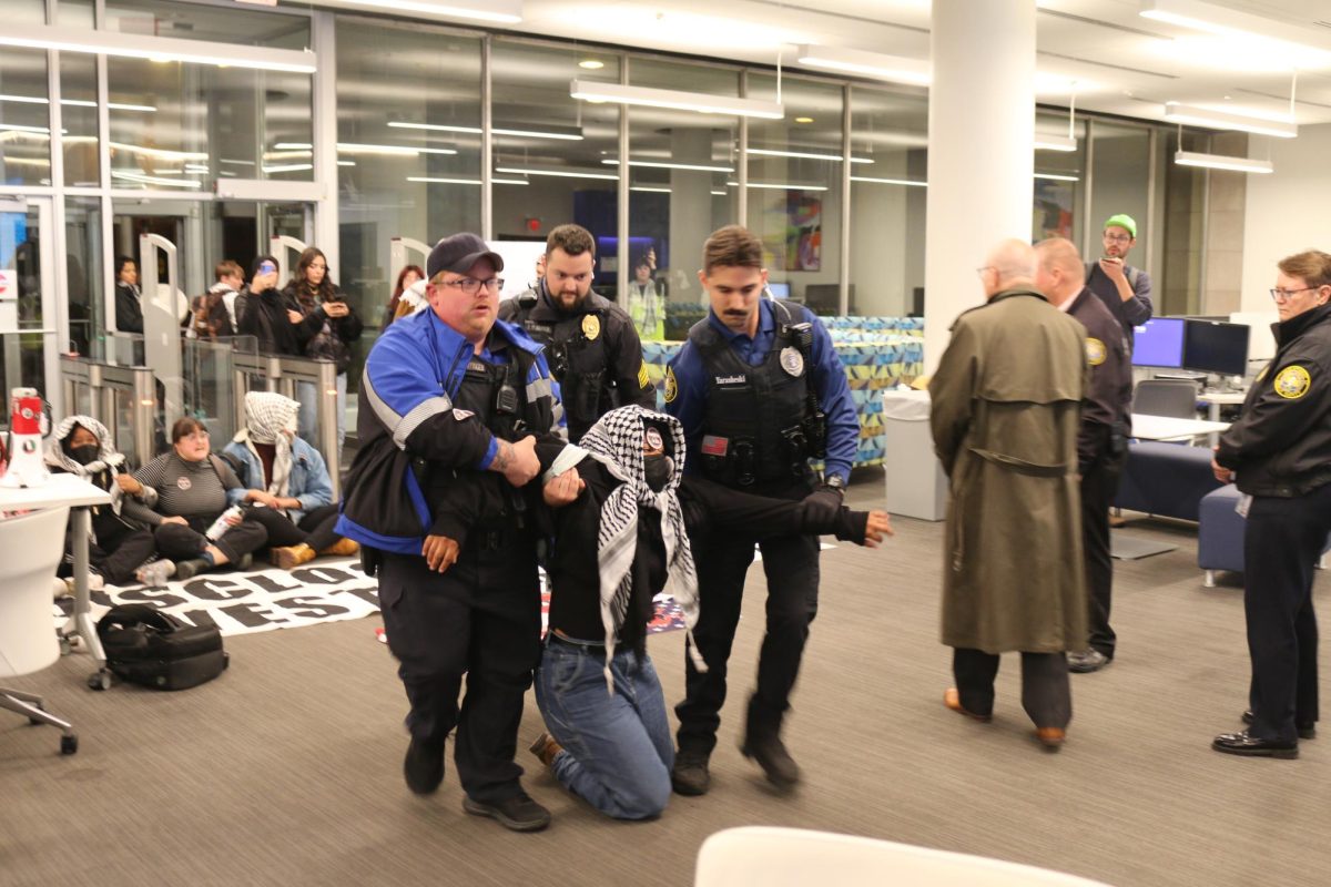 Students being forcibly placed in handcuffs and cable ties by DPS officers after refusing to stop their pro-Palestine demonstration at Pius XII Memorial Library, Oct. 17, 2024. 