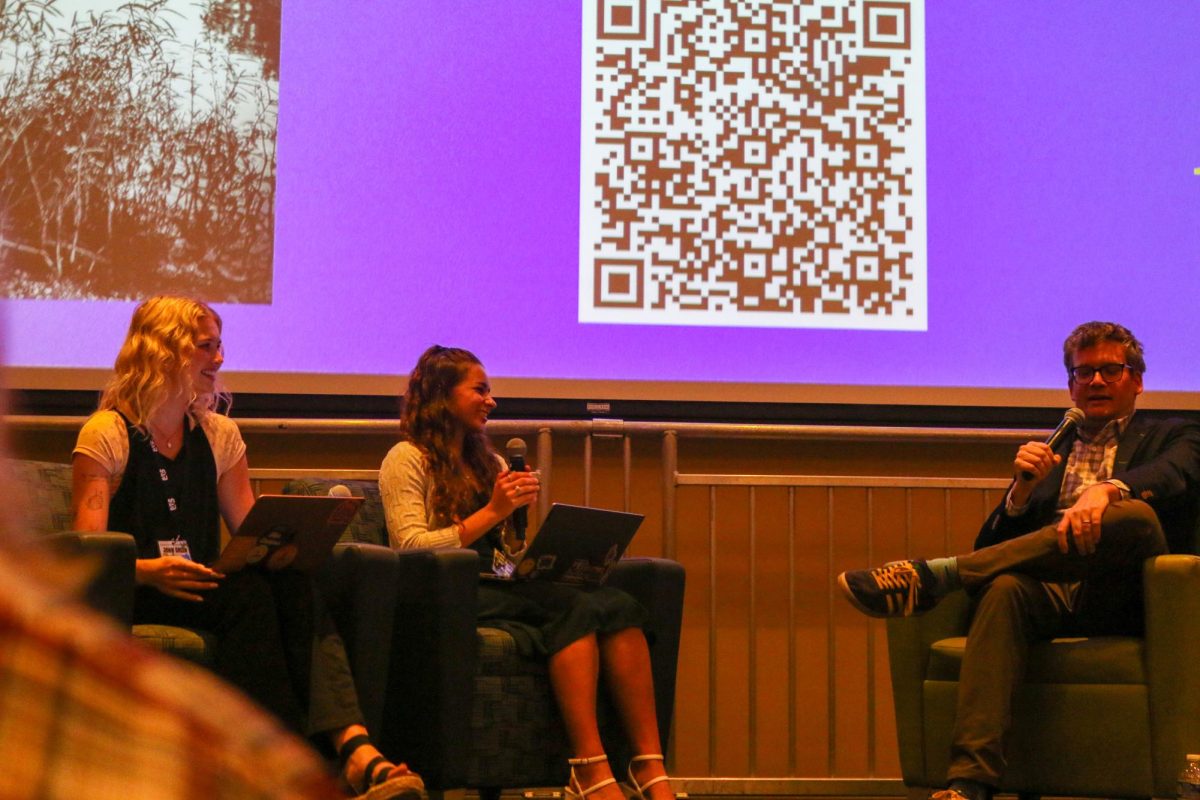 John Green answers questions during his talk in the Wool Ballroom on Sept. 24, moderated by Erin Hanna and Mariya Yasinovska.