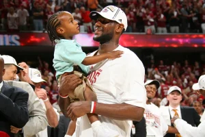 Lebron James embracing a younger Bronny, after the Cleveland Cavaliers became one game closer to being 2007 Eastern Conference Champions. 