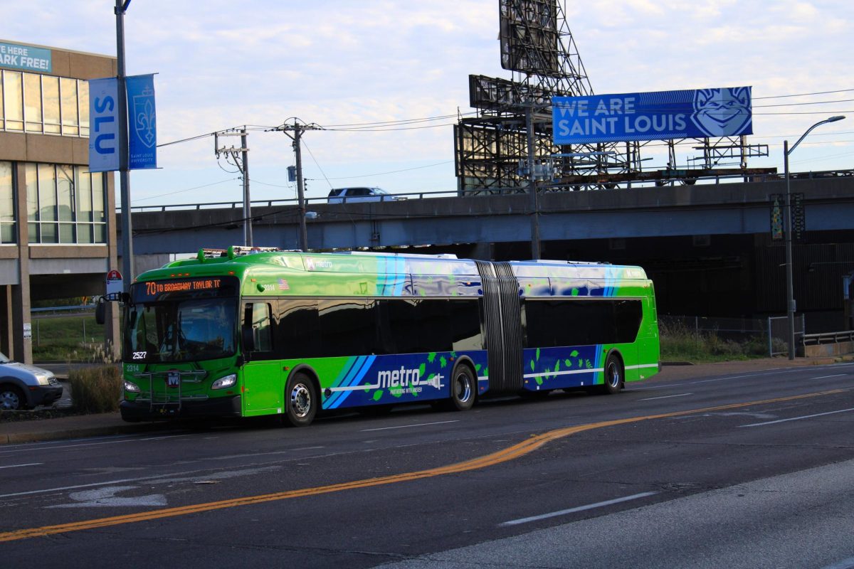 A Metro bus stops to pick up passengers at a bus stop on south Grand Blvd. on Oct. 23, 2024. 