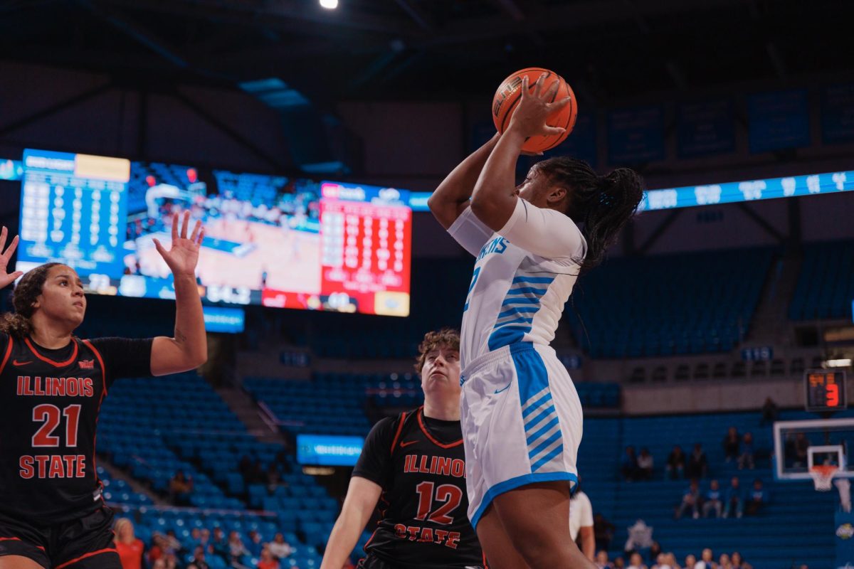 Shun’teria Anumele shoots over Illinois State’s Maya Wong and Neveah Thomas. 