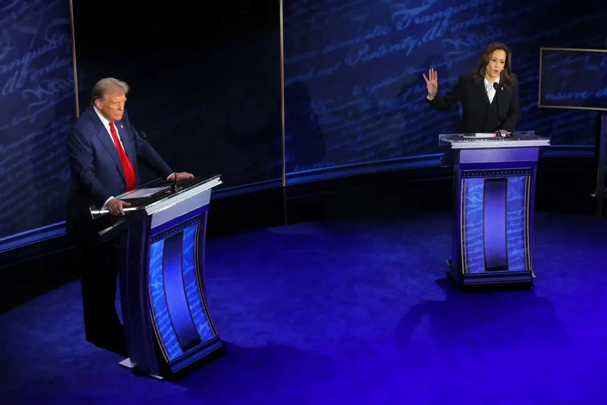 Democratic presidential nominee, U.S. Vice President Kamala Harris speaks during a presidential debate hosted by ABC as Republican presidential nominee, former U.S. President Donald Trump listens, in Philadelphia, Pennsylvania, U.S., September 10, 2024. REUTERS/Brian Snyde