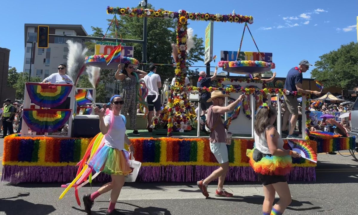 A law firm's pride float in Denver, Colorado at the annual Denver Pride Parade on June 23, 2024. Thousands of LGBTQ+ people and allies gather to be able to celebrate the accomplishment, existence and love of the queer community.