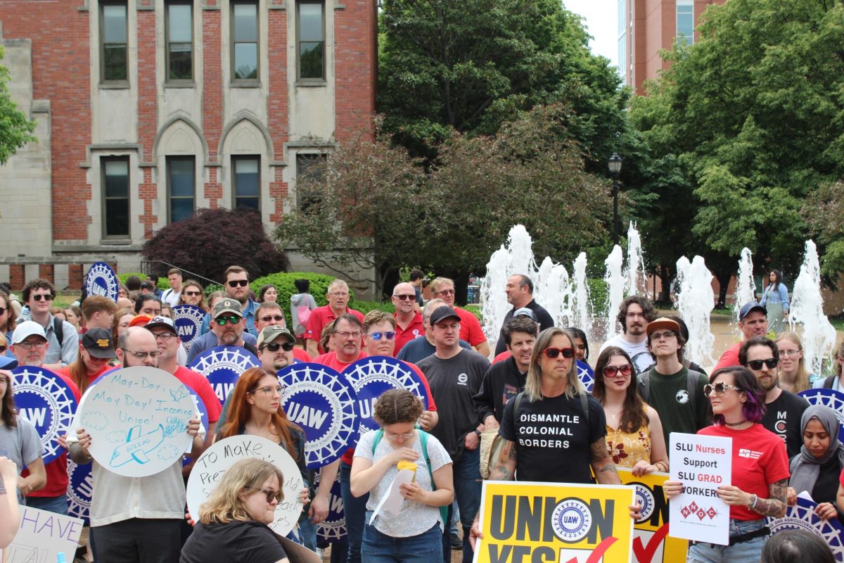 Saint Louis University graduate student workers, professors and local union members demonstrate at the May Day rally at the Clock Tower on on May 1, 2024. The graduate students are set to vote on unionization in early November.