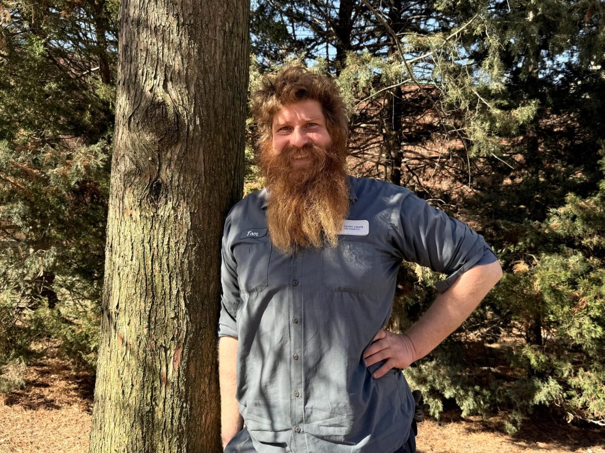 Tommy Wessel poses for a portrait next to a tree on Saint Louis University’s north campus on Jan. 29, 2025. Wessel left the university after working 18 years as a groundskeeper to pursue his passion for native habitat restoration.  (Ulaa Kuziez / The University News)
