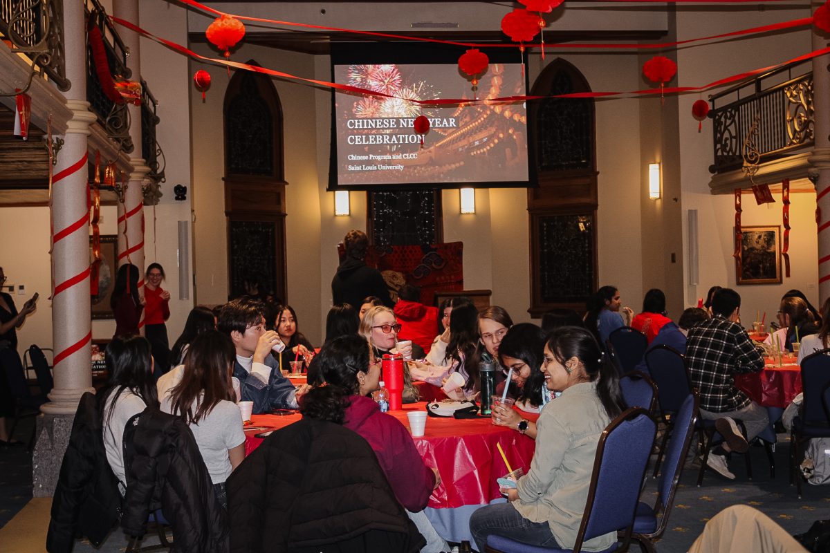 After getting their boba tea, event-goers chat in the Pere Marquette Gallery before the Lunar New Year celebration begins on Jan. 29, 2025. The annual festival was hosted by Saint Louis University's Chinese Language Culture Club. 