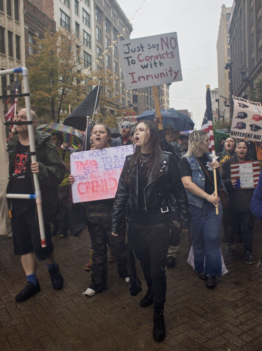 Rebecca Mines and other protesters march at the “No Kings” protest around Keiner Park Plaza on Oct. 18, 2025. (Amber Dantzler)