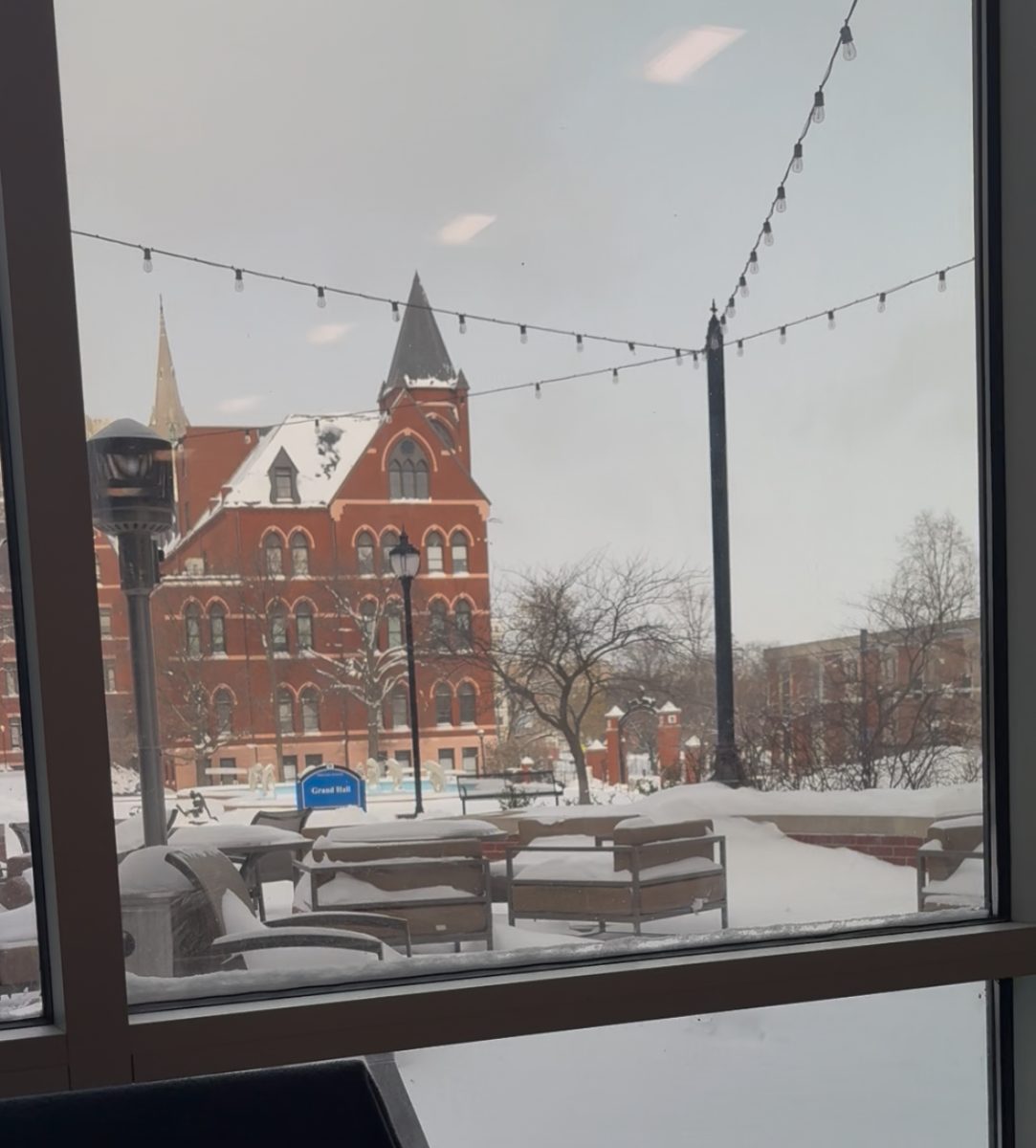 Snow accumulates on the Saint Louis University’s Grand Hall pavilion l on Friday, Jan. 23.
