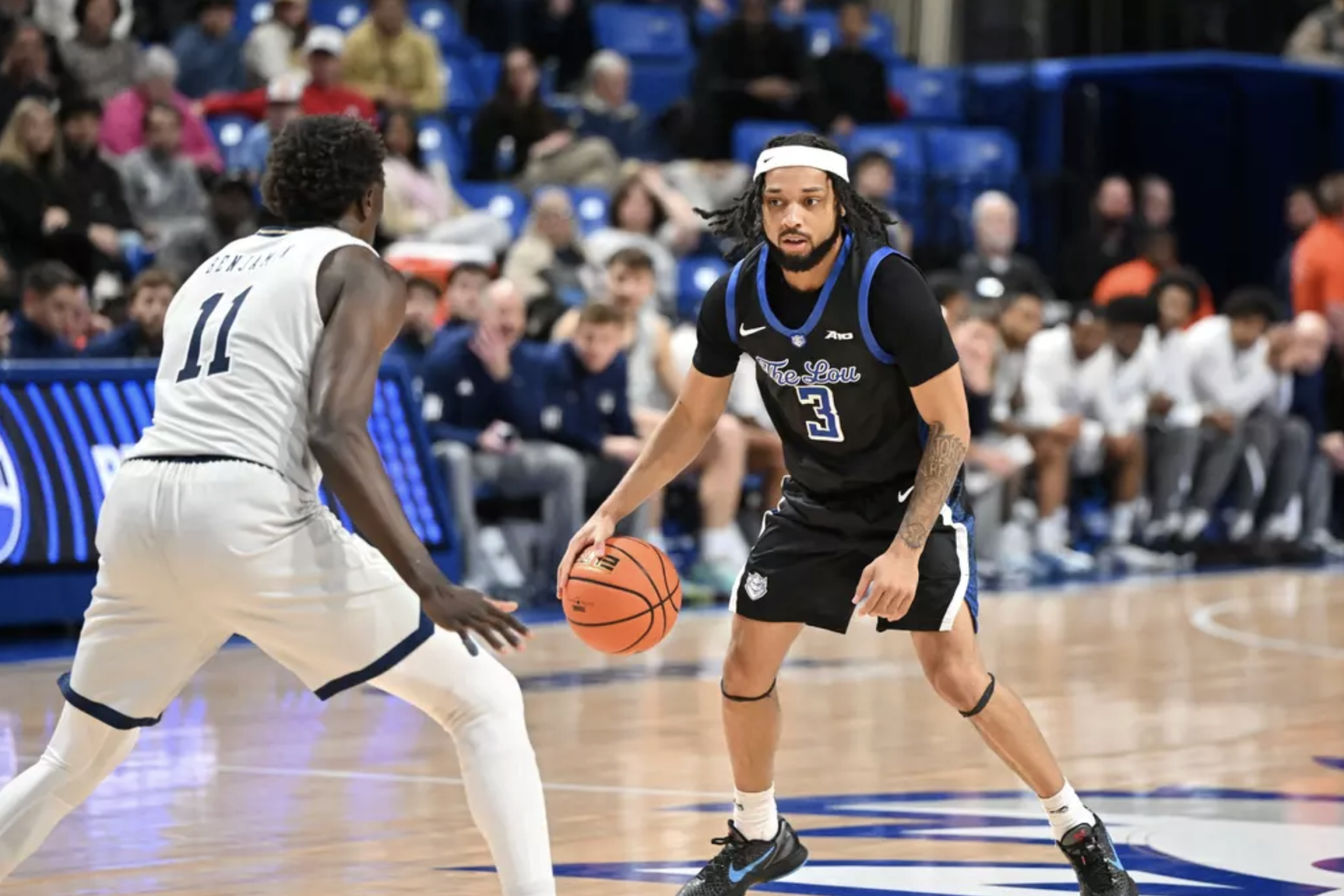 SLU's Trey Green sizing up GW guard Bubu Benjamin in Chaifetz Arena on Jan 27. 