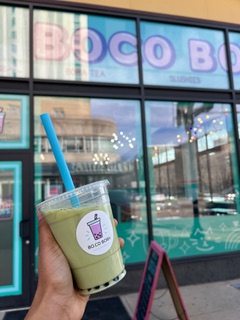BoCo Boba’s matcha latte with tapioca boba in front of the cafe. (BoCo Boba)